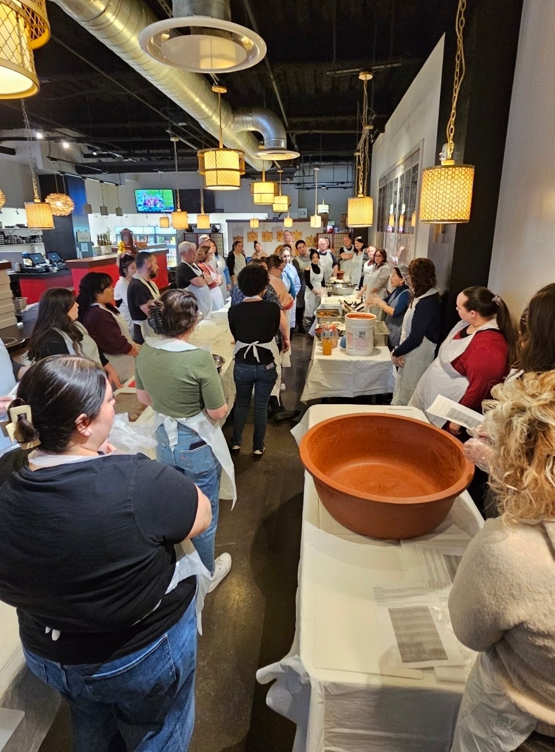 Guests learning to make kimchi at a Yummy's kimchi-making class
